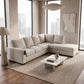 Modern living room with a beige sectional sofa, coffee table, and large windows.