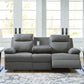 Side-Swipe Reclining Sofa with Drop Down Table